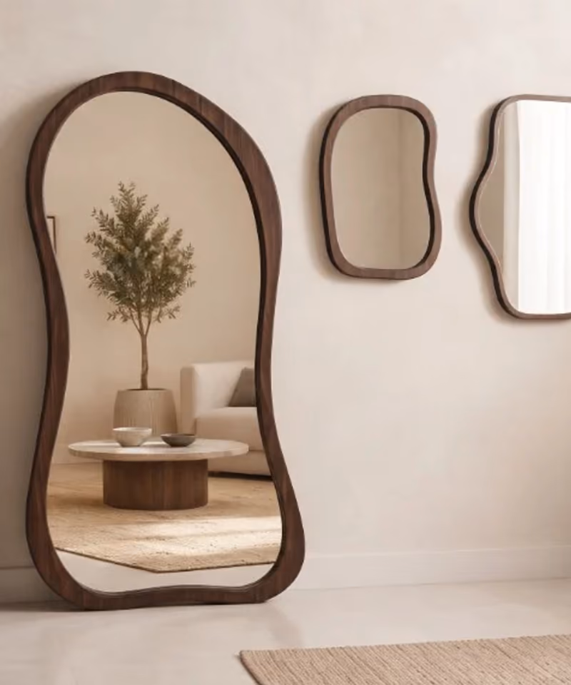 JJ walnut floor and wall mirrors in a pale studio